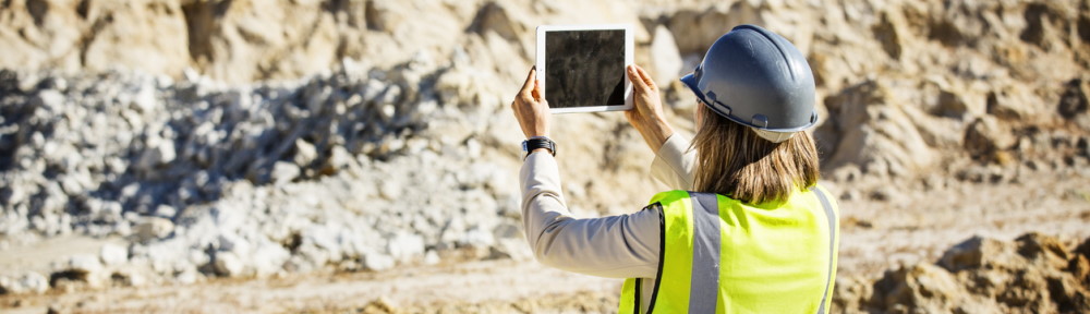 Female architect photographing quarry
